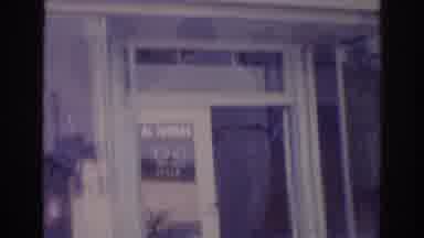 Temple City California (1966): Door And Window Of Glass Reflecting Two Men