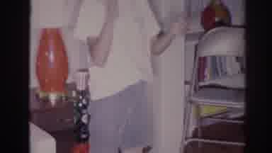 Temple City California (1966): Boy Wearing White Shirt Claps Hands While Standing