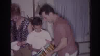 Temple City California (1966): Boy Playing Bongos While Man Holding Bangor In The