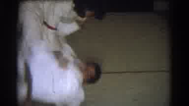 West Covina California (1966): Woman Wearing White Flips Man Wearing White Onto