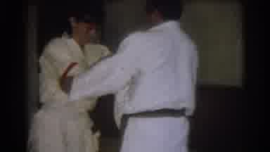West Covina California (1966): Woman Wearing White Karate Uniform Flips Man Unto