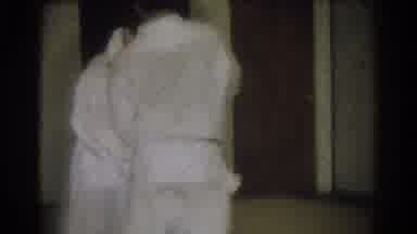 West Covina California (1966): Two Adult Men Practicing Judo In A Room While