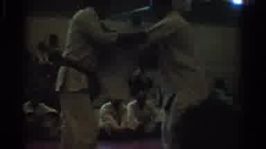 West Covina California (1966): View Of Two Men Wrestling On Red Indoor Mat In
