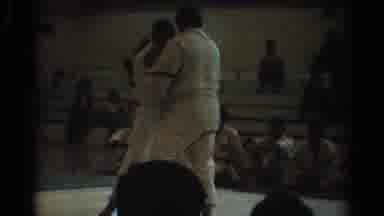 West Covina California (1966): Two People On A Mat Inside Fighting Each Other