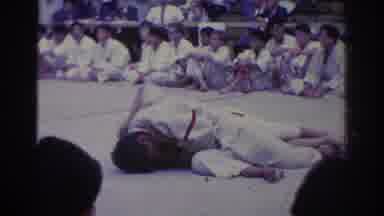 West Covina California (1966): Men Lying On The Ground And Holding Tight In An