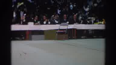 West Covina California (1966): Six Men Wearing Grey Suits Sit At Long White Table