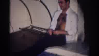 Los Angeles California (1967): A Man With An Open Shirt A White Dog On The Floor