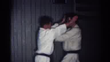 Los Angeles California (1967): Two Males Sparring Inside With Their Karate GI