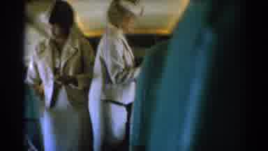 Los Angeles California (1967): Multiple Flight Attendant Walking Down Rows