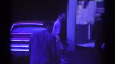 Los Angeles California (1967): Man Wearing White Shirt Walks Toward Building