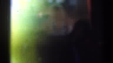 Los Angeles California (1967): Person Wearing Black Suit Walks Through Dimly Lit