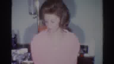Los Angeles California (1967): Woman Wearing Pink Sweater Turns Face Away From