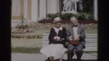 Moscow Russia (1968): Elderly Couple Sitting On A Bench Being Approached By A