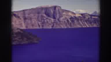 Crater Lake Oregon-1937: Scenic View of Deep Blue Waters and Volcanic Cliffs
