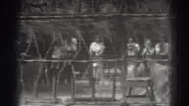 El Monte California (1937): Group Of People Watch A Thin Lion Walking In A Cage At