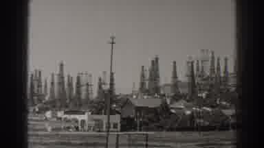 Long Beach California (1937): View Of Oil Rigs Scattered Along Hillside And Valley