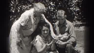 Long Beach California (1937): Woman Wearing White Apron Takes Object From Man