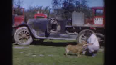 Sacramento California (1937): Woman Petting Small Dog Near Large Red And Black