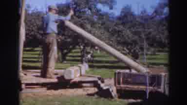 Sacramento California (1937): Man Is Seen Stopping And Holding A Cylindrical