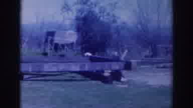 Sacramento California (1937): Person Wearing White Pants Throws Debris On Ground