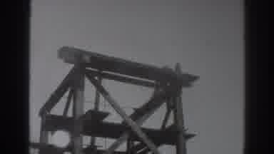 SACRAMENTO CALIFORNIA-1937: Worker Climbing Scaffolding At Construction Site