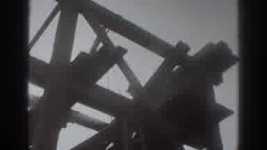 Sacramento California (1937): A Worker Moves Beams Atop A Structure Under