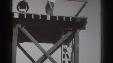 Sacramento California (1937): Woman On Tall Platform Steals The Hat Of A Man