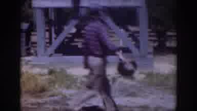 Sacramento California (1937): Man Wearing Blue Shirt Walks Past Blue Square Object