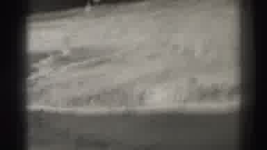 Santa Cruz California (1937): View Of Surf Crashing Against Boulders On A Clear