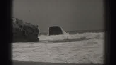 Santa Cruz California (1937): View Of Water Waves Crashing Against Boulders On A