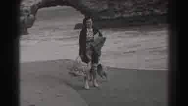 Santa Cruz California (1937): Woman Standing Walking Dog On Beach With Loose Dog