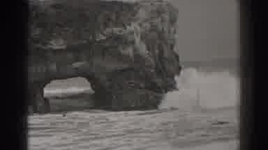 Santa Cruz California (1937): Images Of Ocean Waves Crashing On A Rock Formation