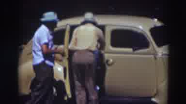 Truckee California (1937): Dark Place Maybe At Night With People Getting Into A