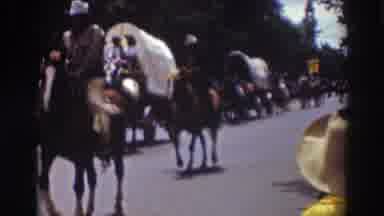 Truckee California (1937): People On Horseback And Horse Drawn Covered Wagons In