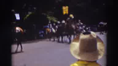 Truckee California (1937): Man Wearing White Cowboy Hat Carries Yellow Flag While