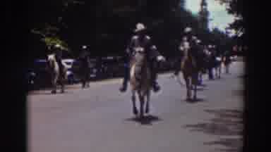Truckee California (1937): People Wearing White Shirts Ride Horses In Parade On A