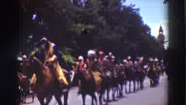 Truckee California (1937): Men Are Parading Down The Road On Their Horses In