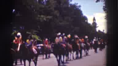 Truckee California (1937): A Group Of Fancily Dressed People Ride In Formation