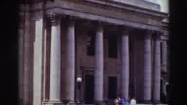 Truckee California (1937): A Classic Building With Columns And People Going Down