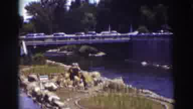 Truckee California (1937): Car Passing On A Bridge Over A River There Is Grass