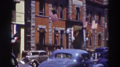 Truckee California (1937): The View Of A Large Building With Us Flags And Other