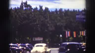 Truckee California (1937): Yellow Biggie Leaving Parking Lot Into Town Mountain