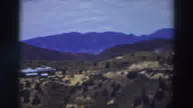 Truckee California (1937): The View Of Mountains And Trees On Hills With Small