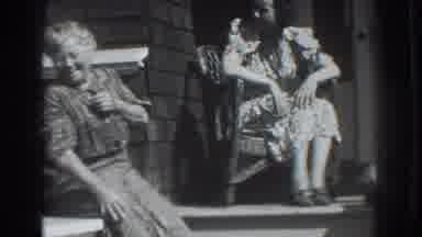 Vacaville California (1937): Two Women In Dresses Sitting Down And Talking And