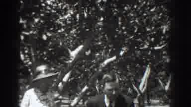 Vacaville California (1937): Woman Wearing White Dress And Hat Stands Under Tree