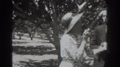 Vacaville California (1937): Woman Giving Her Hat To Someone Else