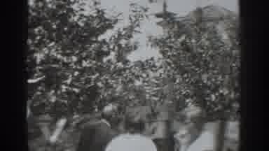 Vacaville California (1937): People At An Orchard Eating Apples While Walking