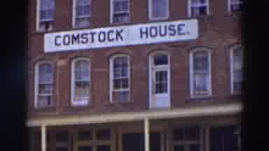 Virginia City California (1937): View Of Blue And White Comstock House Sign On A