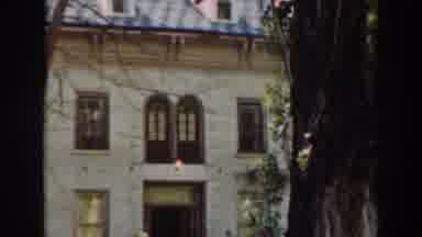 Virginia City California (1937): View Of Tan And Yellow House On A Clear Day
