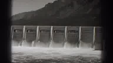 Bonneville Dam Oregon (1938): A Big Dam Relieving Water With A Mountain In The